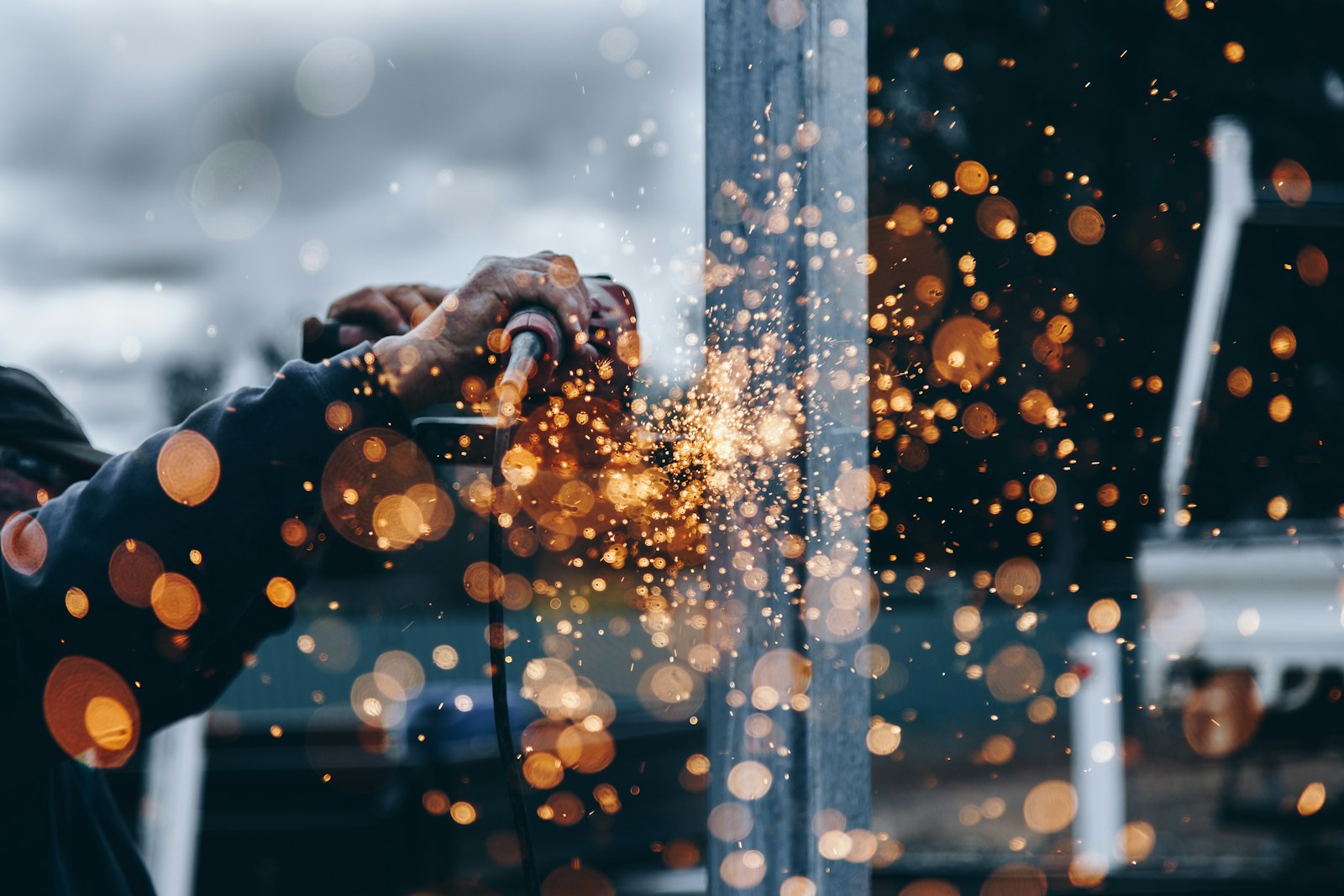 Skilled tradesperson welding metal during an apprenticeship placement